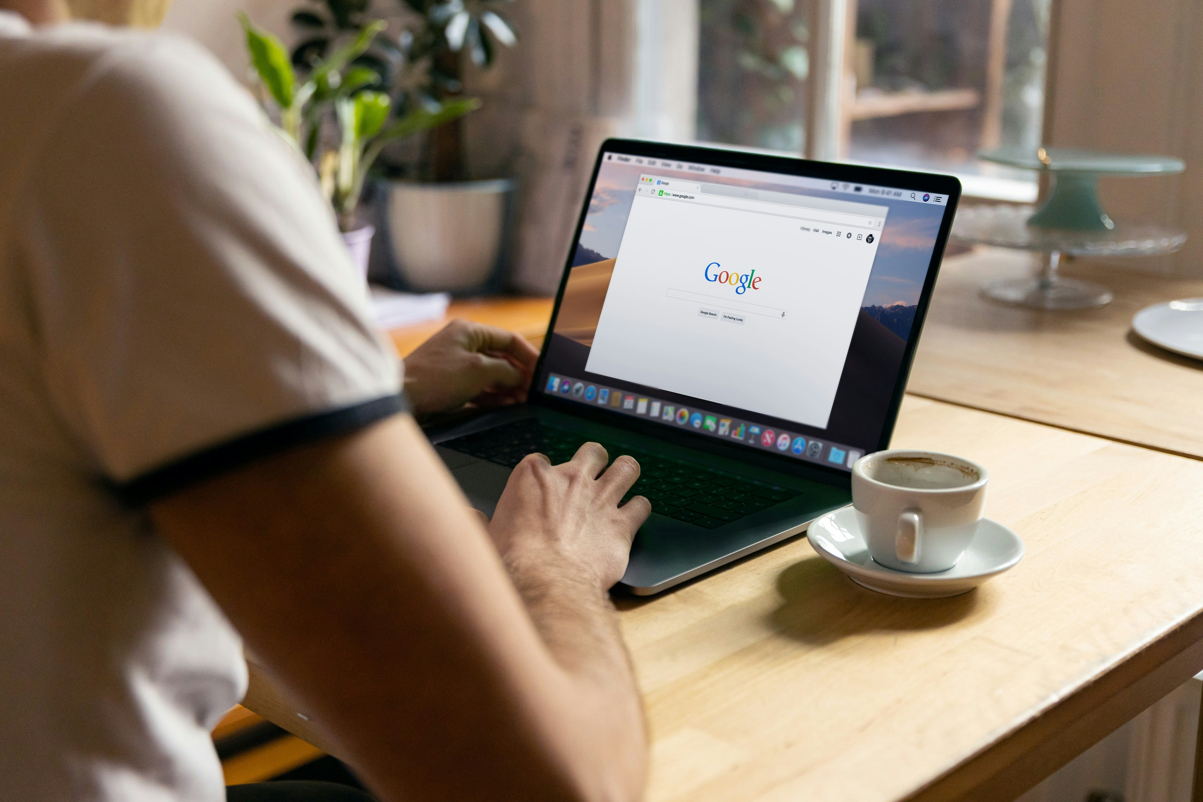 Person using a laptop with Google search open, representing SEO